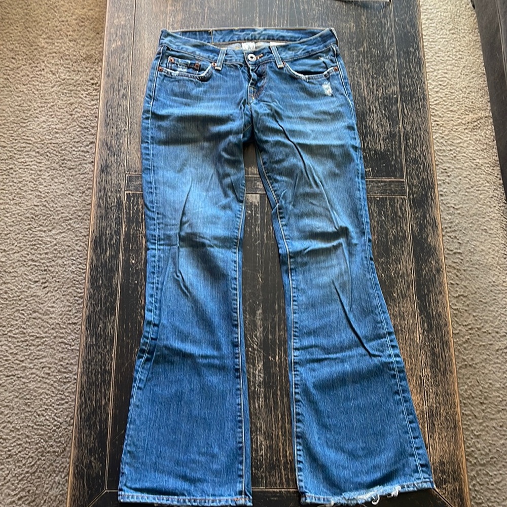 Lucky Brand “Lil’ Maggie” Jean. Dark denim, low rise, slightly distressed.